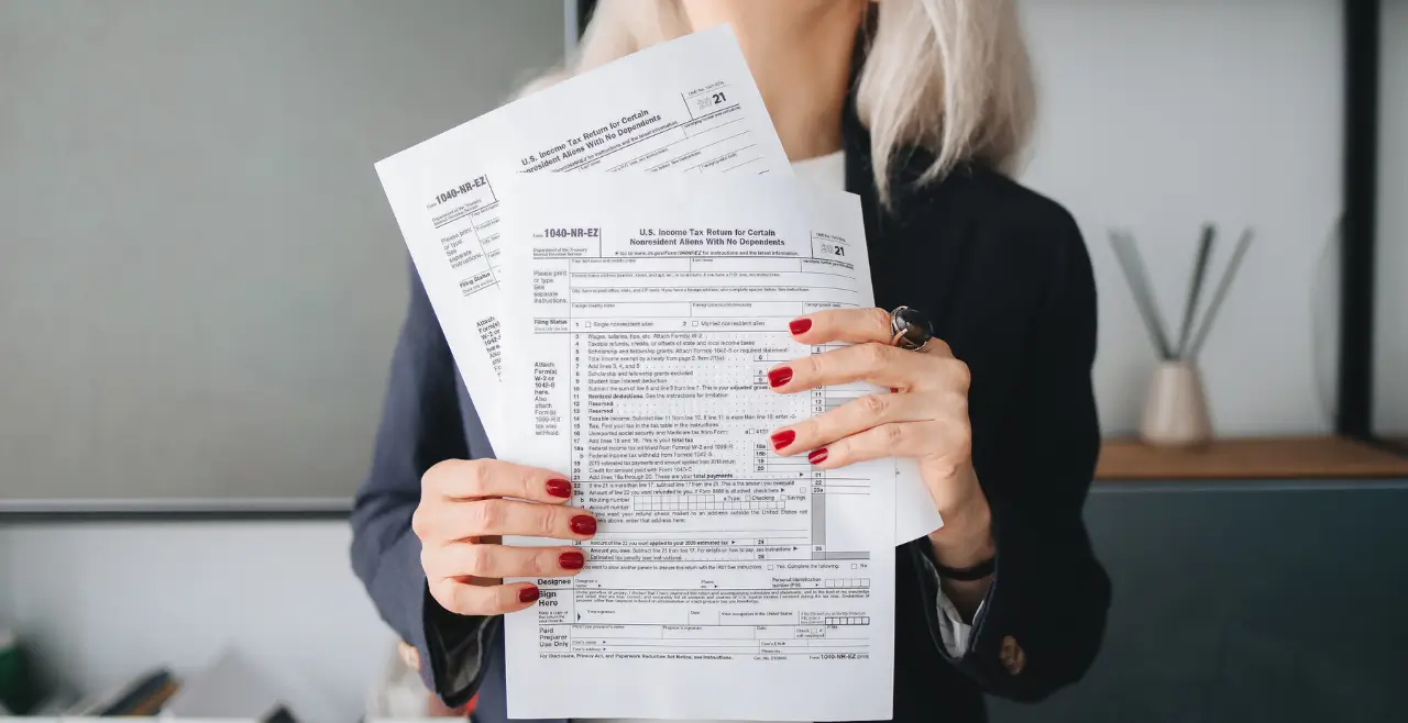 Accountant holding a stack of papers